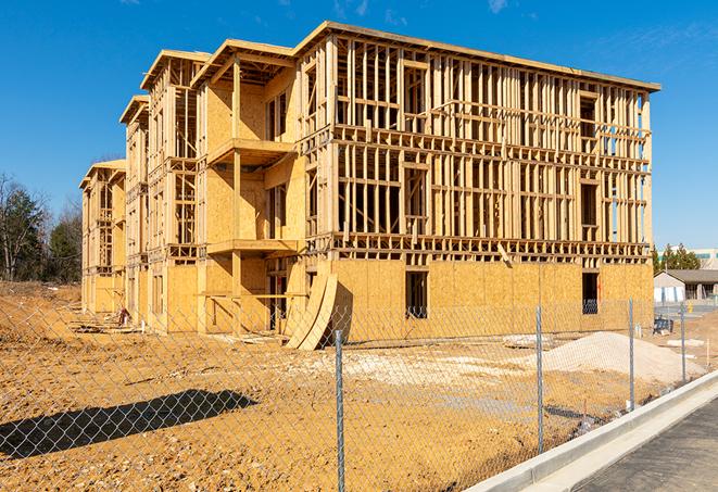 a view of a temporary chain link fence that surrounds a construction site, providing security in Moreno Valley